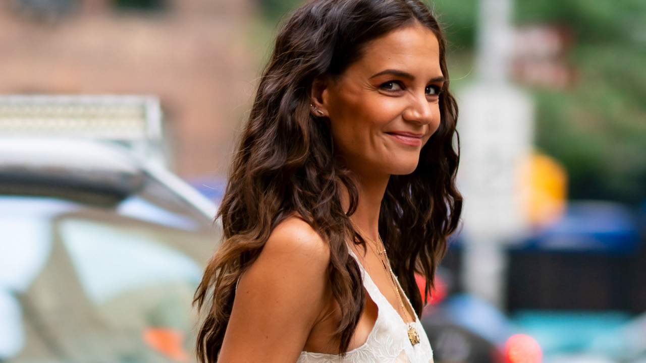 American actress Katie Holmes spotted carrying a Longchamp Le Pliage Cuir  Etoiles clutch.