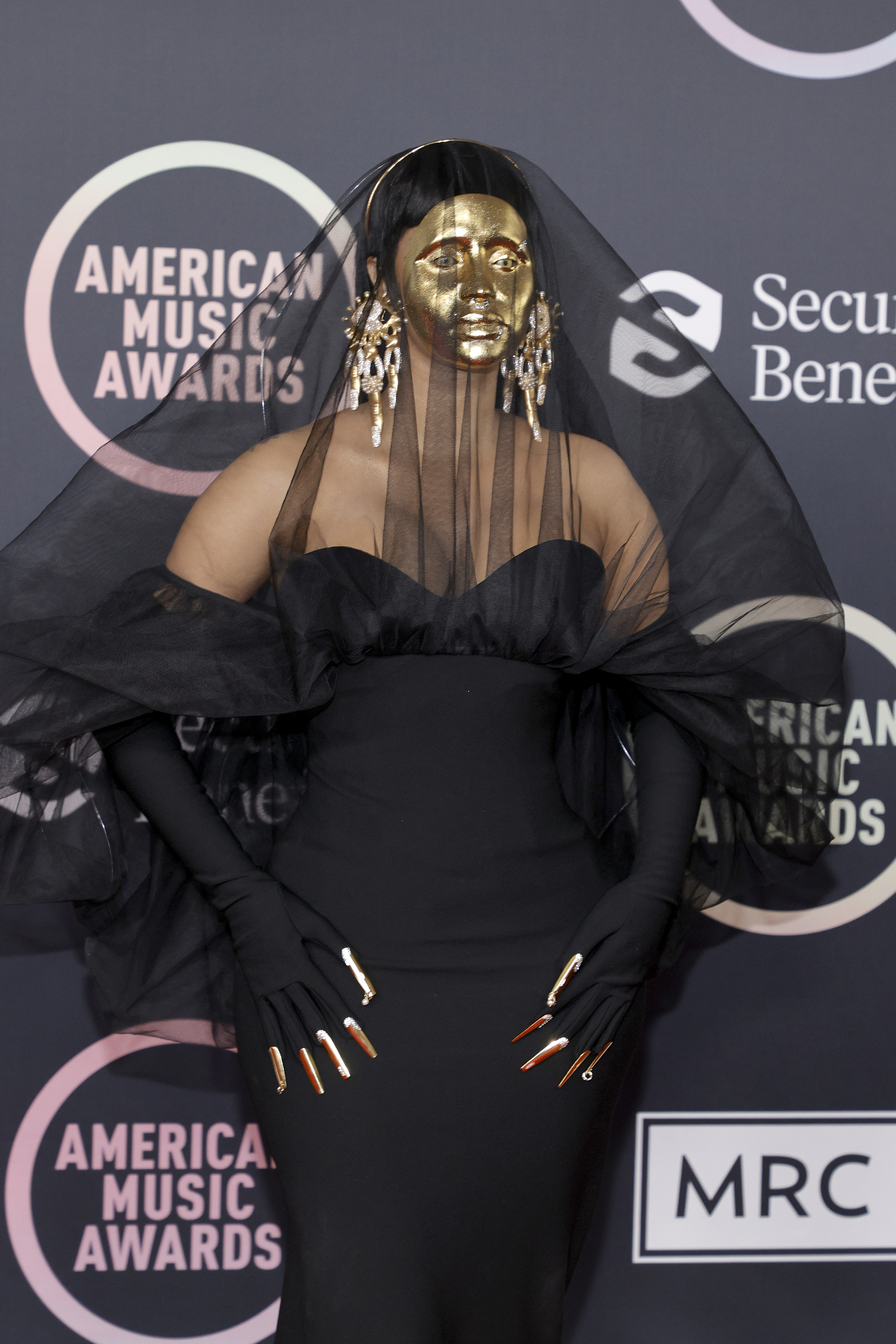 AMAs: Cardi B Arrives On The Red Carpet Wearing Gold Schiaparelli Mask