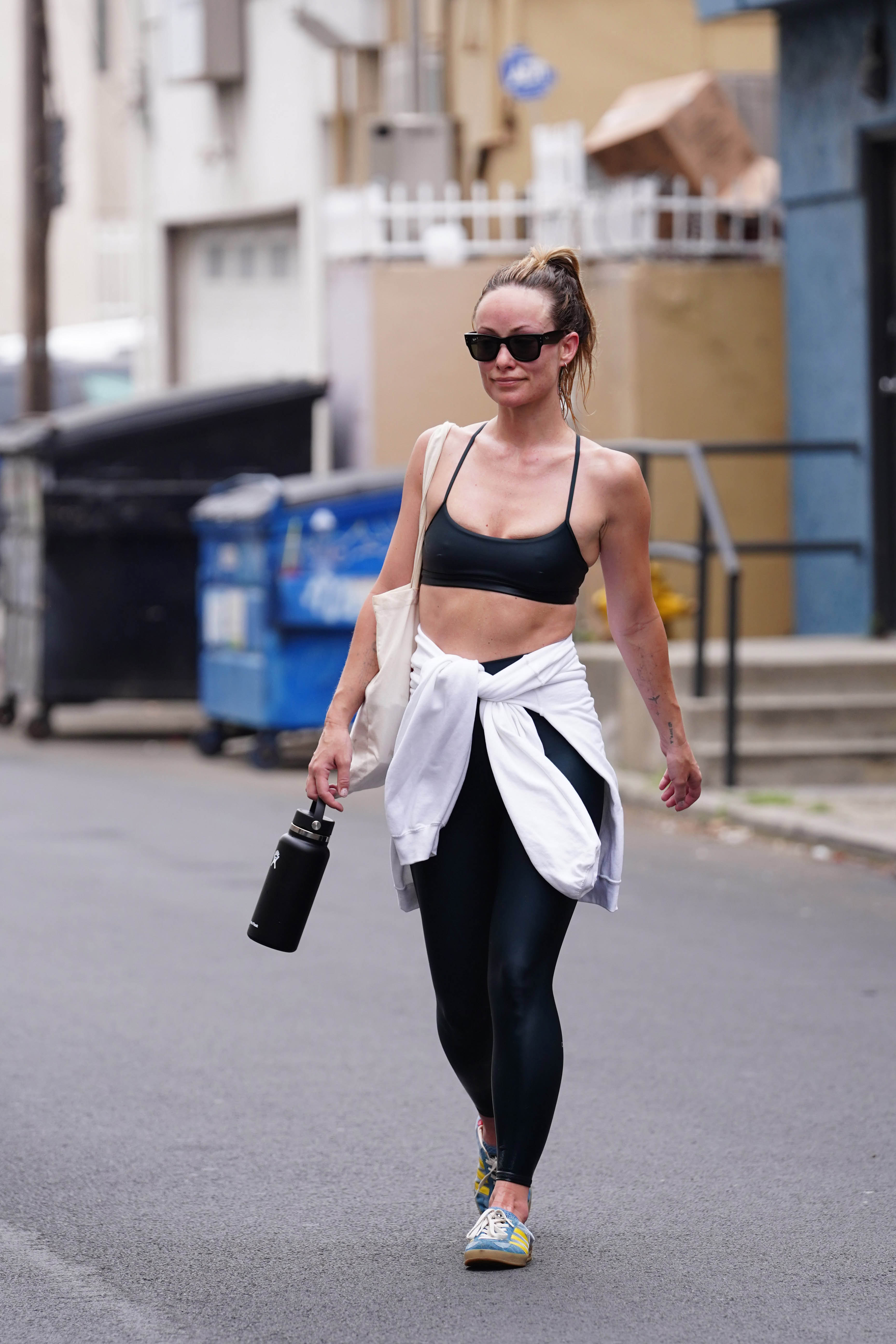 Olivia Wilde showcases gym-honed physique in clinging leggings after  addressing Harry Styles romance