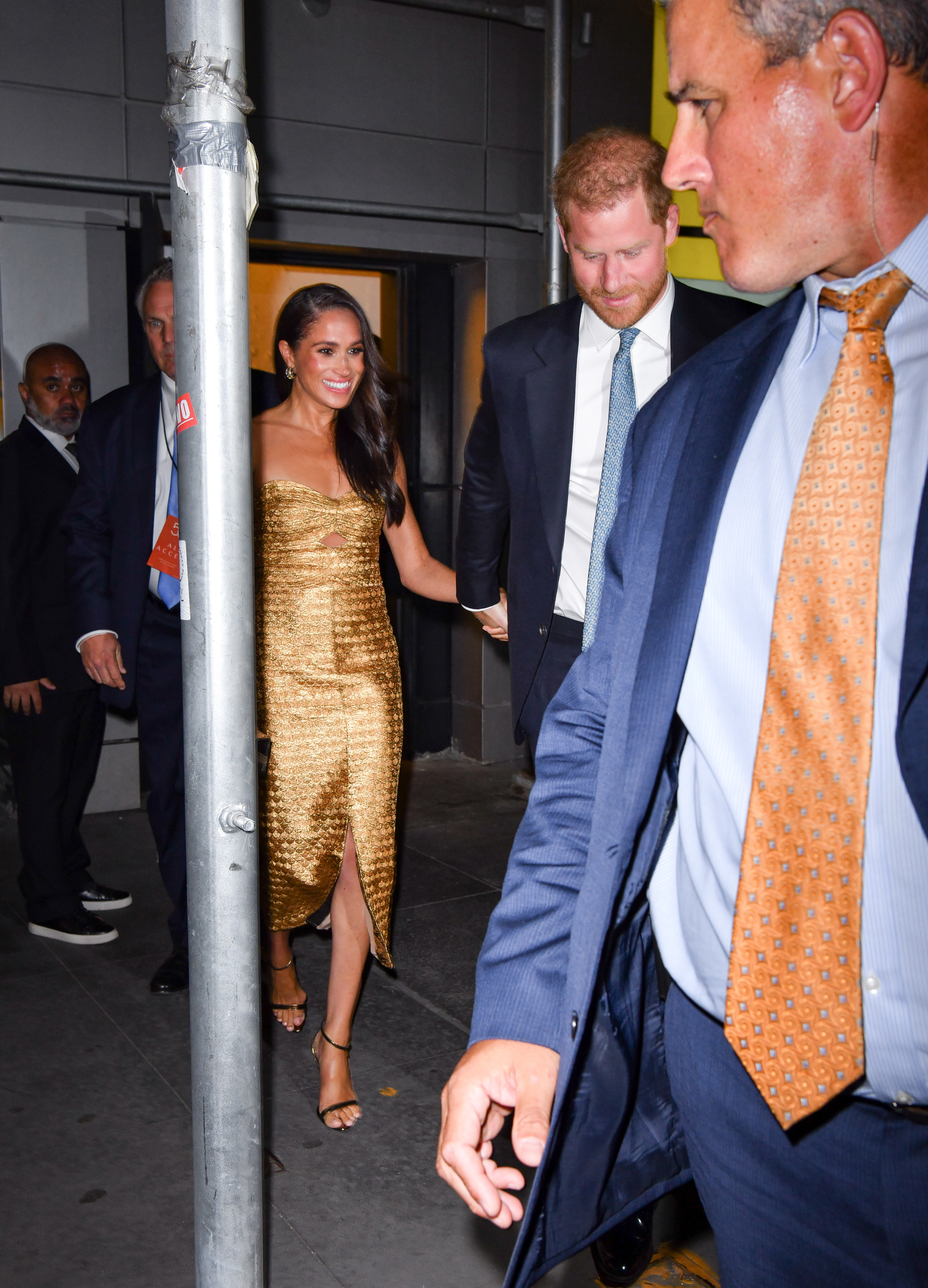 Meghan Markle Wears Gold Cutout Strapless Dress