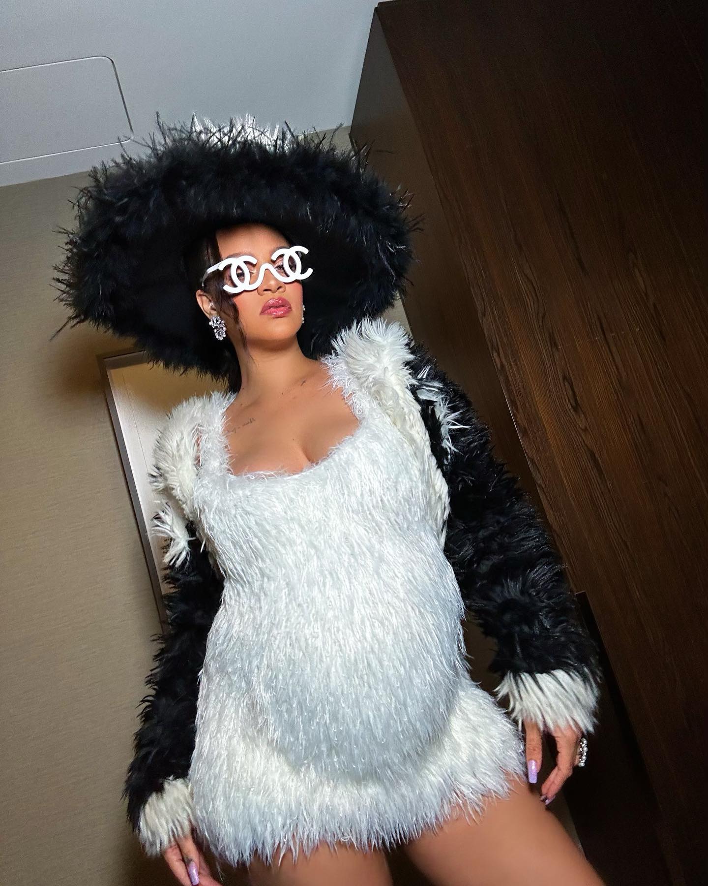 Rihanna in a pre met gala mood yesterday wearing a fur coat & shades from  the chanel fall 1994 collection 🤍