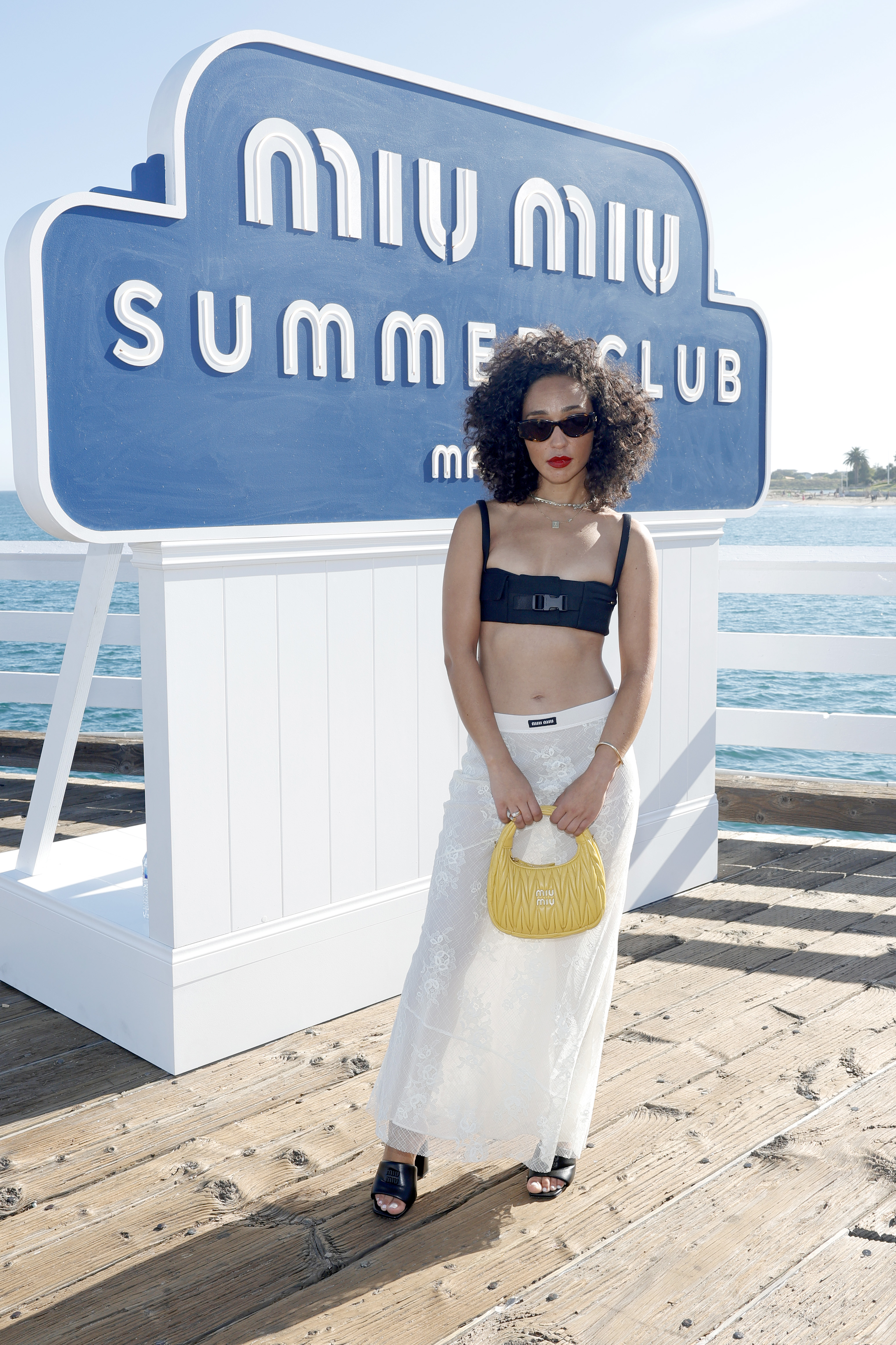 Maddie Ziegler Coordinates Bralette and Skirt at Miu Miu's Summer Party